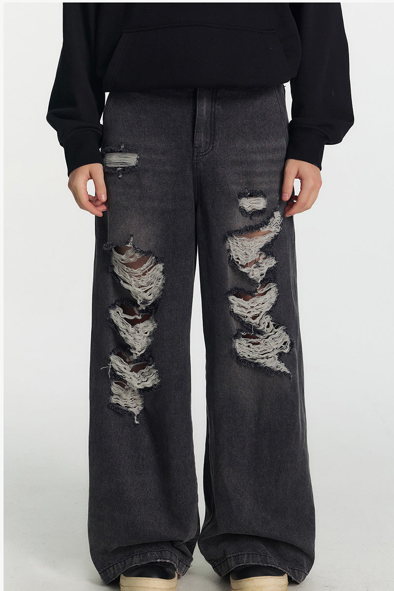 Jean femme oversize délavé à déchirures, coupe large et longue style streetwear tendance