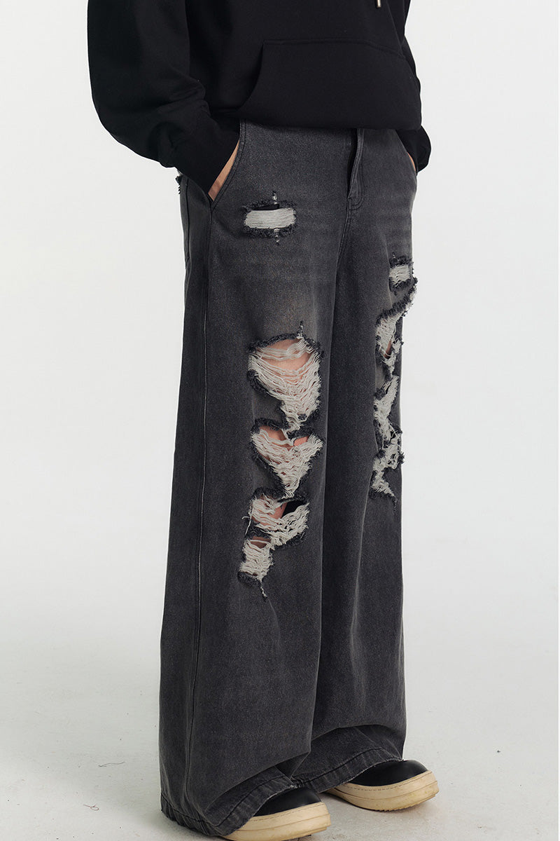 Jean femme oversize délavé à déchirures, coupe large et longue style streetwear tendance