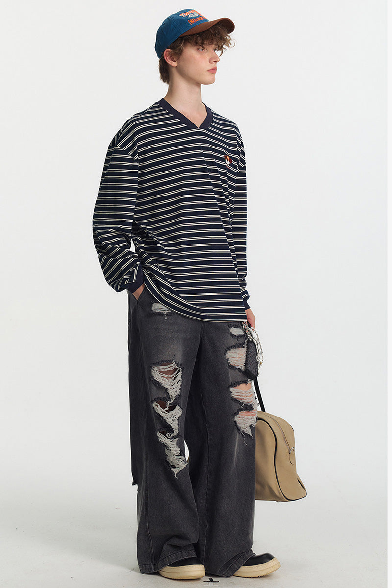 Jean femme oversize délavé à déchirures, coupe large et longue style streetwear tendance