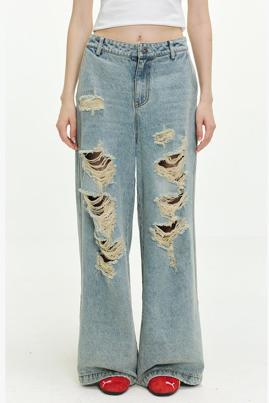 Jean femme oversize délavé à déchirures, coupe large et longue style streetwear tendance